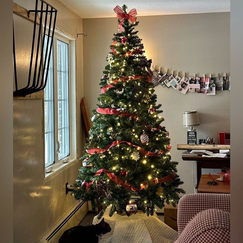 Pre-lit artificial Christmas tree. White lights 6.5 feet
